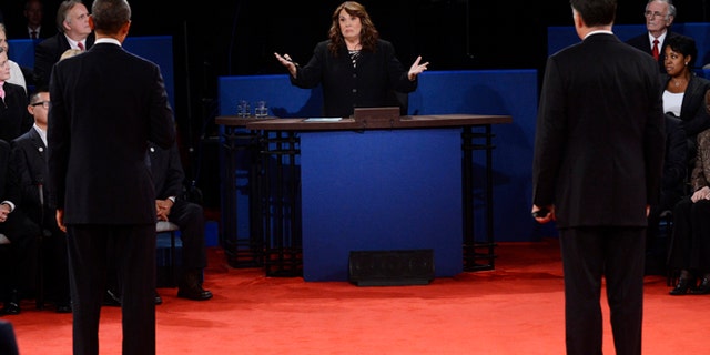 Oct. 16, 2012: Moderator Candy Crowley, center, addresses President Barack Obama, left, and Republican presidential nominee Mitt Romney during the second presidential debate.