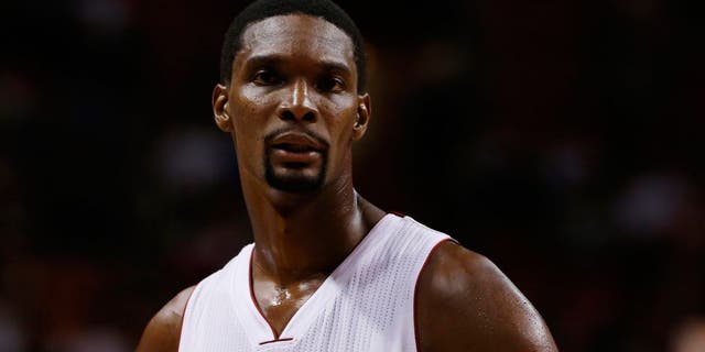 Oct 7, 2014; Miami, FL, USA; Miami Heat forward Chris Bosh (1) in the first half of a game against the Orlando Magic at American Airlines Arena. The Magic won 108-101in over time. Mandatory Credit: Robert Mayer-USA TODAY Sports