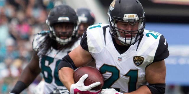 Oct 18, 2015; Jacksonville, FL, USA; Jacksonville Jaguars running back Toby Gerhart (21) runs during the second quarter against the Houston Texans at EverBank Field. Mandatory Credit: Logan Bowles-USA TODAY Sports