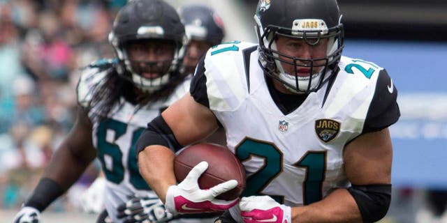 Oct 18, 2015; Jacksonville, FL, USA; Jacksonville Jaguars running back Toby Gerhart (21) runs during the second quarter against the Houston Texans at EverBank Field. Mandatory Credit: Logan Bowles-USA TODAY Sports