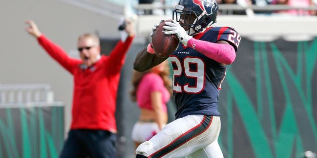 Houston Texans defensive back Andre Hal (29) returns an interception 31-yards for a touchdown against the Jacksonville Jaguars during the second half of an NFL football game in Jacksonville, Fla., Sunday, Oct. 18, 2015. (AP Photo/Stephen B. Morton)
