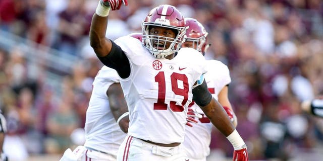 Oct 17, 2015; College Station, TX, USA; Alabama Crimson Tide linebacker Reggie Ragland (19) reacts after a play during the third quarter against the Texas A&M Aggies at Kyle Field. The Crimson Tide defeated the Aggies 41-23. Mandatory Credit: Troy Taormina-USA TODAY Sports