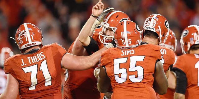 Oct 17, 2015; Athens, GA, USA; Georgia Bulldogs place kicker Marshall Morgan (finger raised) and team mates react after he kicked the go ahead field goal against the Missouri Tigers during the second half at Sanford Stadium. Georgia defeated Missouri 9-6. Mandatory Credit: Dale Zanine-USA TODAY Sports