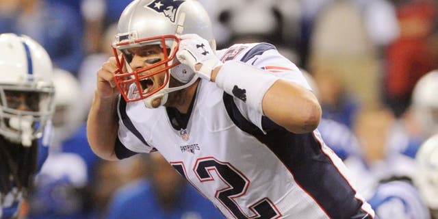 Oct 18, 2015; Indianapolis, IN, USA; New England Patriots quarterback Tom Brady (12) calls out at the line against the Indianapolis Colts in the first half during the NFL game at Lucas Oil Stadium. Mandatory Credit: Thomas J. Russo-USA TODAY Sports