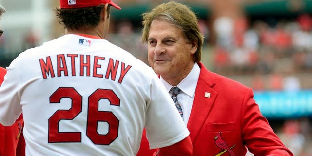 ST. LOUIS, MO - APRIL 13: Former St. Louis Cardinals manager Tony La Russa greets manager Mike Matheny #26 before a game against the Milwaukee Brewers at Busch Stadium on April 13, 2015 in St. Louis, Missouri. (Photo by Jeff Curry/Getty Images)