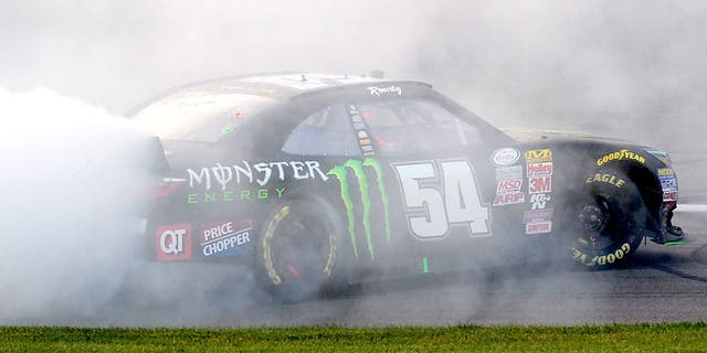 KANSAS CITY, KS - OCTOBER 17: Kyle Busch, driver of the #54 Monster Energy Toyota, celebrates with a burnout after winning the NASCAR XFINITY Series Kansas Lottery 300 at Kansas Speedway on October 17, 2015 in Kansas City, Kansas. (Photo by Robert Laberge/NASCAR via Getty Images)