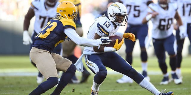 GREEN BAY, WI - OCTOBER 18: Keenan Allen #13 of the San Diego Chargers carries the football against Damarious Randall #23 of the Green Bay Packers in the second quarter at Lambeau Field on October 18, 2015 in Green Bay, Wisconsin. (Photo by Stacy Revere/Getty Images)