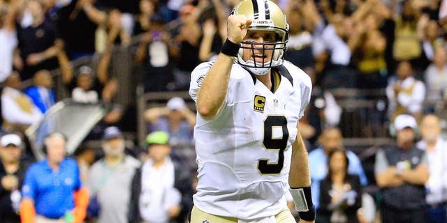 Oct 15, 2015; New Orleans, LA, USA; New Orleans Saints quarterback Drew Brees (9) celebrates after a touchdown run by running back Mark Ingram (not pictured) during the fourth quarter of a game at the Mercedes-Benz Superdome. Mandatory Credit: Derick E. Hingle-USA TODAY Sports