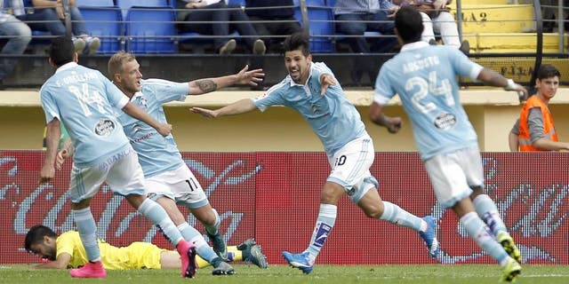 Celta Vigo's forward Nolito (2ndR) celebrates his goal with teammates during the Spanish league football match Villarreal CF vs RC Celta de Vigo at El Madrigal stadium in Villareal on October 18, 2015. AFP PHOTO/ JOSE JORDAN (Photo credit should read JOSE JORDAN/AFP/Getty Images)