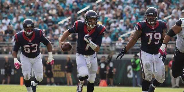 Oct 18, 2015; Jacksonville, FL, USA; Houston Texans quarterback Brian Hoyer (7) runs for a first down in the fourth quarter against the Jacksonville Jaguars at EverBank Field. The Houston Texans won 31-20. Mandatory Credit: Logan Bowles-USA TODAY Sports