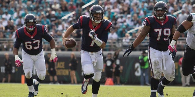 Oct 18, 2015; Jacksonville, FL, USA; Houston Texans quarterback Brian Hoyer (7) runs for a first down in the fourth quarter against the Jacksonville Jaguars at EverBank Field. The Houston Texans won 31-20. Mandatory Credit: Logan Bowles-USA TODAY Sports