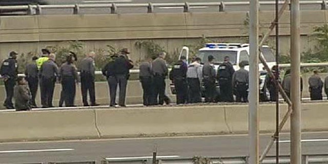 Oct. 19: Law Enforcement Officers search for evidence along the I-395 expressway adjacent to the Pentagon (Fox News).