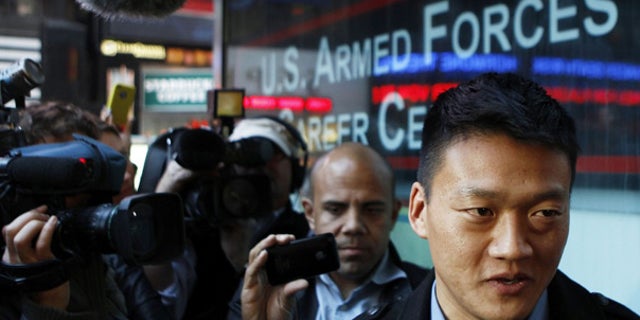 Oct. 19: Discharged U.S. Army Lt. Daniel Choi speaks with the media outside after attempting to re-enlist at the Times Square military recruitment station in New York.