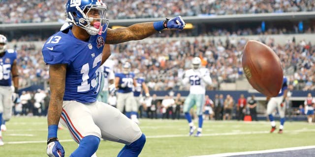 Oct 19, 2014; Arlington, TX, USA; New York Giants wide receiver Odell Beckham Jr. (13) celebrates his second quarter touchdown against the Dallas Cowboys at AT&T Stadium. Mandatory Credit: Matthew Emmons-USA TODAY Sports