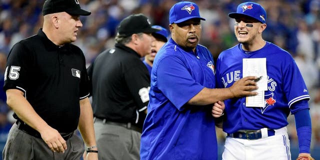 TORONTO, ON - OCTOBER 19: Troy Tulowitzki #2 of the Toronto Blue Jays reacts as he is ejected from the game in the eighth inning against the Kansas City Royals during game three of the American League Championship Series at Rogers Centre on October 19, 2015 in Toronto, Canada. (Photo by Harry How/Getty Images)
