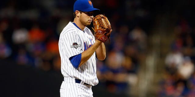 NEW YORK, NY - OCTOBER 13: Steven Matz #32 of the New York Mets prepares to throw a pitch in the first inning against the Los Angeles Dodgers during game four of the National League Division Series at Citi Field on October 13, 2015 in New York City. (Photo by Mike Stobe/Getty Images)