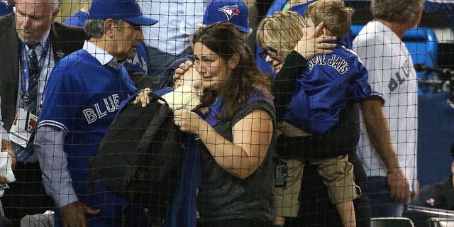 TORONTO, ON- OCTOBER 14: An infant was allegedly hit by a beer can during the protest. The Toronto Blue Jays and Texas Rangers play game four of the MLB American League Division Series . at Rogers Centre in Toronto. October 14, 2015. (Steve Russell/Toronto Star via Getty Images)