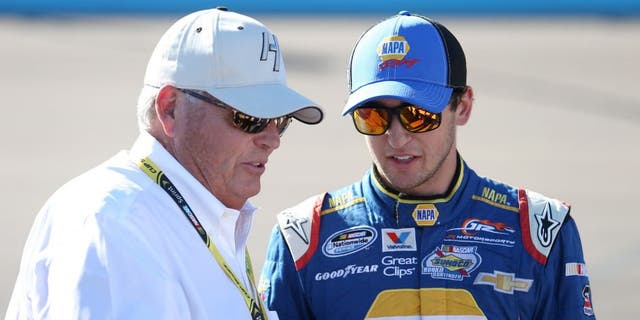 AVONDALE, AZ - NOVEMBER 08: Chase Elliott, driver of the #9 NAPA Auto Parts Chevrolet, stands on the grid with team owner Rick Hendrick prior to the NASCAR Nationwide Series DAV 200 at Phoenix International Raceway on November 8, 2014 in Avondale, Arizona. (Photo by Todd Warshaw/Getty Images)