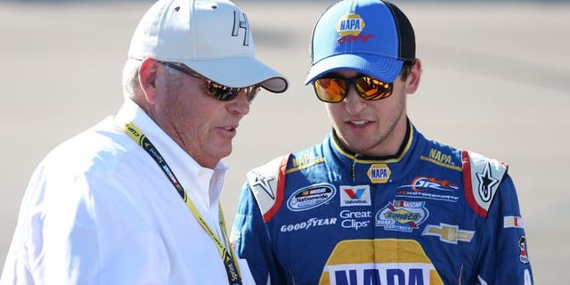 AVONDALE, AZ - NOVEMBER 08: Chase Elliott, driver of the #9 NAPA Auto Parts Chevrolet, stands on the grid with team owner Rick Hendrick prior to the NASCAR Nationwide Series DAV 200 at Phoenix International Raceway on November 8, 2014 in Avondale, Arizona. (Photo by Todd Warshaw/Getty Images)