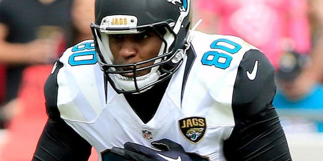 JACKSONVILLE, FL - OCTOBER 18: Julius Thomas #80 of the Jacksonville Jaguars makes a reception against Kevin Johnson #30 of the Houston Texans during the game at EverBank Field on October 18, 2015 in Jacksonville, Florida. (Photo by Sam Greenwood/Getty Images)