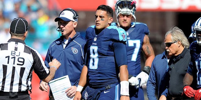 Oct 18, 2015; Nashville, TN, USA; Tennessee Titans quarterback Marcus Mariota (8) is helped off the field after an injury during the first half against the Miami Dolphins at Nissan Stadium. Mandatory Credit: Christopher Hanewinckel-USA TODAY Sports
