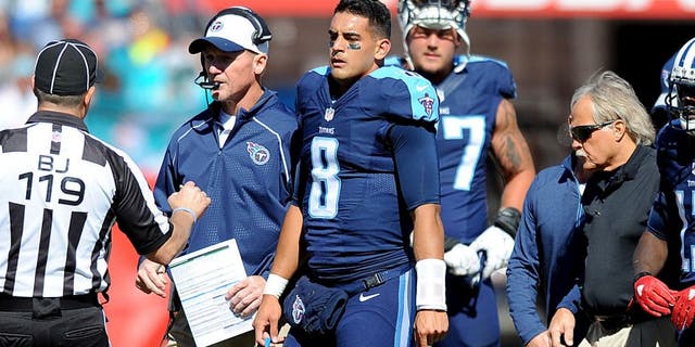 Oct 18, 2015; Nashville, TN, USA; Tennessee Titans quarterback Marcus Mariota (8) is helped off the field after an injury during the first half against the Miami Dolphins at Nissan Stadium. Mandatory Credit: Christopher Hanewinckel-USA TODAY Sports