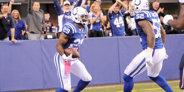 Oct 18, 2015; Indianapolis, IN, USA; Indianapolis Colts strong safety Mike Adams (29) celebrates with inside linebacker D'Qwell Jackson (52) after returning an interception for a touchdown against the New England Patriots in the first half during the NFL game at Lucas Oil Stadium. Mandatory Credit: Thomas J. Russo-USA TODAY Sports