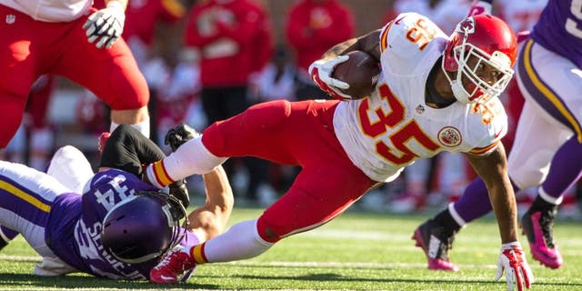 Oct 18, 2015; Minneapolis, MN, USA; Kansas City Chiefs running back Charcandrick West (35) is tackled by Minnesota Vikings safety Andrew Sendejo (34) during the fourth quarter at TCF Bank Stadium. The Vikings defeated the Chiefs 16-10. Mandatory Credit: Brace Hemmelgarn-USA TODAY Sports
