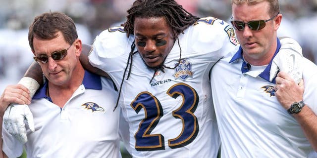 Oct 18, 2015; Santa Clara, CA, USA; Baltimore Ravens free safety Kendrick Lewis (23) is helped off the field during the second quarter of the game against the San Francisco 49ers at Levi's Stadium. The 49ers defeated the Ravens 25-20. Mandatory Credit: Ed Szczepanski-USA TODAY Sports