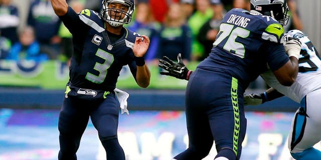 SEATTLE, WA - OCTOBER 18: Quarterback Russell Wilson #3 of the Seattle Seahawks throws the ball against the Carolina Panthers at CenturyLink Field on October 18, 2015 in Seattle, Washington. (Photo by Jonathan Ferrey/Getty Images)