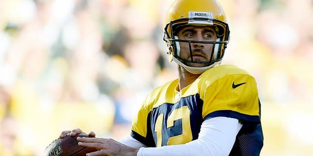 GREEN BAY, WI - OCTOBER 18: Aaron Rodgers #12 of the Green Bay Packers drops back to pass during a game against the San Diego Chargers at Lambeau Field on October 18, 2015 in Green Bay, Wisconsin. Green Bay defeated San Diego 27-20. (Photo by Stacy Revere/Getty Images)