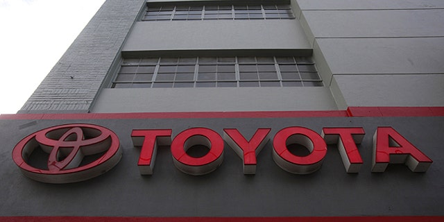 The sign at San Francisco Toyota car dealership is shown in San Francisco, in this Jan. 26, 2010 file photo. Toyota Motor Corp. said Thursday Oct. 21 it is recalling 1.53 million Lexus, Avalon and other models, mostly in the U.S. and Japan, for brake fluid and fuel pump problems.