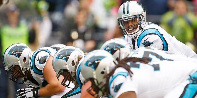 Oct 18, 2015; Seattle, WA, USA; Carolina Panthers quarterback Cam Newton (1) stands over center against the Seattle Seahawks during the third quarter at CenturyLink Field. Carolina defeated Seattle, 27-23. Mandatory Credit: Joe Nicholson-USA TODAY Sports