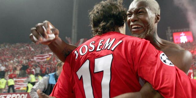 Istanbul, Turkey: Liverpool's Spanish Defender Josemi Jesemi and Liverpool's French striker Djibril Cisse celebrate after winning at the UEFA Champions league football final AC Milan vs Liverpool, 25 May 2005 at the Ataturk Stadium in Istanbul. Liverpool won 3-2 on penalties. AFP PHOTO FILIPPO MONTEFORTE (Photo credit should read FILIPPO MONTEFORTE/AFP/Getty Images)