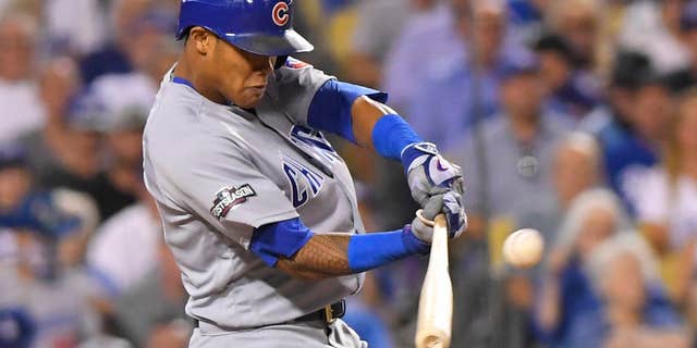 Oct. 20, 2016: Chicago Cubs' Addison Russell hits a two-run home run off Los Angeles Dodgers relief pitcher Joe Blanton during the sixth inning of Game 5 of the National League baseball championship series.