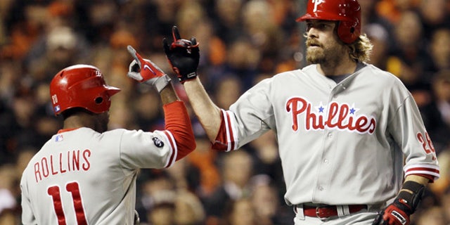 Oct. 21: Philadelphia Phillies' Jayson Werth, right, is congratulated by Jimmy Rollins after Werth hit a home run during the ninth inning in San Francisco.
