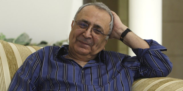 Oct. 17: Iranian-American businessman Reza Taghavi, 71, sits at his home a day after he was released from Evin prison in Tehran, Iran.