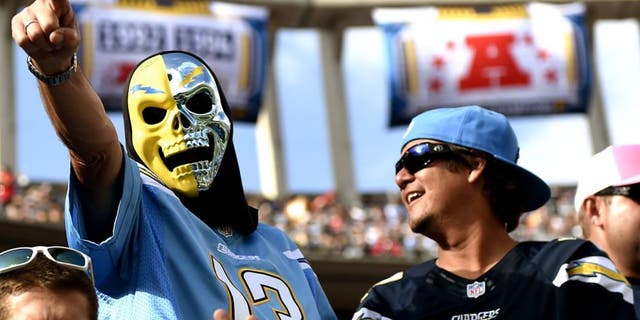 SAN DIEGO, CA - OCTOBER 19: San Diego Chargers fans cheer for their team during the NFL football game against Kansas City Chiefs at Qualcomm Stadium on October 19, 2014, in San Diego, California. (Photo by Kevork Djansezian/Getty Images)