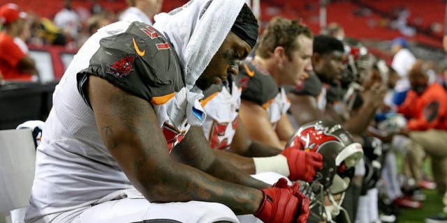 Sep 18, 2014; Atlanta, GA, USA; Tampa Bay Buccaneers defensive end Da'Quan Bowers (91) reacts on the sideline during their loss to the Atlanta Falcons in the fourth quarter at the Georgia Dome. The Falcons won 56-14. Mandatory Credit: Jason Getz-USA TODAY Sports