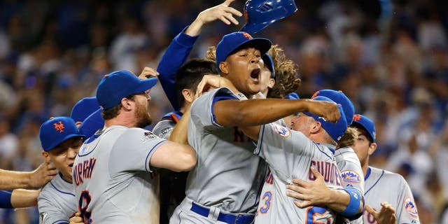 LOS ANGELES, CA - OCTOBER 15: Jeurys Familia #27 of the New York Mets celebrates after the Mets 3-2 victory against the Los Angeles Dodgers in game five of the National League Division Series at Dodger Stadium on October 15, 2015 in Los Angeles, California. (Photo by Sean M. Haffey/Getty Images)