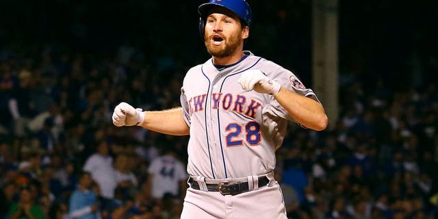 CHICAGO, IL - OCTOBER 21: Daniel Murphy #28 of the New York Mets celebrates after hitting a two run home run in the eighth inning against Pedro Strop #46 of the Chicago Cubs during game four of the 2015 MLB National League Championship Series at Wrigley Field on October 21, 2015 in Chicago, Illinois. (Photo by Elsa/Getty Images)