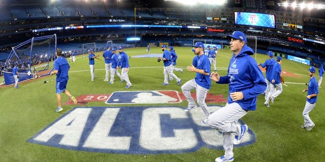 TORONTO, CANADA - OCTOBER 21: Members of the Kansas City Royals loosen up during batting practice before Game 5 of the ALCS against the Toronto Blue Jays at the Rogers Centre on Wednesday, October 21, 2015 in Toronto, Canada. (Photo by Jon Blacker/MLB Photos via Getty Images)