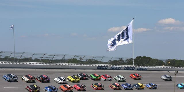 Jimmie Johnson, driver of the #48 Lowe's Chevrolet, and Jeff Gordon, driver of the #24 Drive To End Hunger Chevrolet, lead the field during the NASCAR Sprint Cup Series GEICO 500 at Talladega Superspeedway on May 3, 2015 in Talladega, Alabama.
