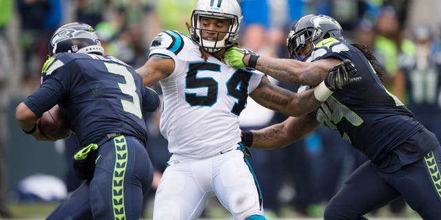 Oct 18, 2015; Seattle, WA, USA; Carolina Panthers linebacker Shaq Thompson (54) pursues Seattle Seahawks quarterback Russell Wilson (3) as running back Marshawn Lynch (24) blocks during the second half at CenturyLink Field. Lynch was called for holding on the play. The Panthers won 27-23. Mandatory Credit: Troy Wayrynen-USA TODAY Sports