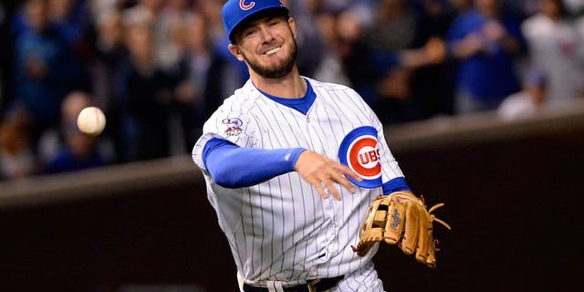 CHICAGO, IL - OCTOBER 20: Kris Bryant #17 of the Chicago Cubs throws to first base during Game 3 of the NLCS against the New York Mets at Wrigley Field on Tuesday, October 20, 2015 in Chicago , Illinois. (Photo by Ron Vesely/MLB Photos via Getty Images)
