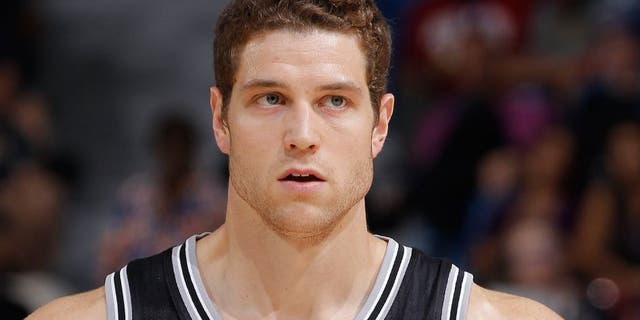 SACRAMENTO, CA - OCTOBER 8: Jimmer Fredette #16 of the San Antonio Spurs looks on during the game against the Sacramento Kings on October 8, 2015 at Sleep Train Arena in Sacramento, California. NOTE TO USER: User expressly acknowledges and agrees that, by downloading and or using this photograph, User is consenting to the terms and conditions of the Getty Images Agreement. Mandatory Copyright Notice: Copyright 2015 NBAE (Photo by Rocky Widner/NBAE via Getty Images)