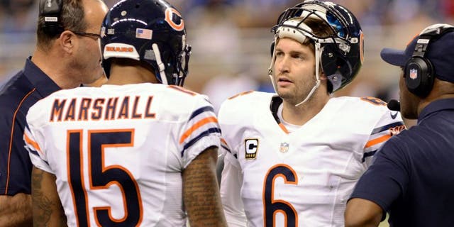 DETROIT, MI - DECEMBER 30: Brandon Marshall #15 and Jay Cutler #6 of the Chicago Bears talk with coaches on the sidelines during the game against the Detroit Lions at Ford Field on December 30, 2012 in Detroit, Michigan. The Bears defeated the Lions 26-24. (Photo by Mark Cunningham/Detroit Lions/Getty Images)