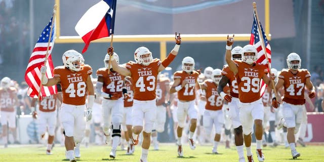 Oct 10, 2015; Dallas, TX, USA; Texas Longhorns players takes the field before the game against the Oklahoma Sooners at the Red River rivalry at Cotton Bowl Stadium. Texas won 24-17. Mandatory Credit: Tim Heitman-USA TODAY Sports