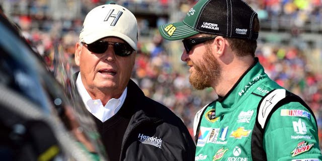 KANSAS CITY, KS - OCTOBER 18: Dale Earnhardt Jr., driver of the #88 Halo 5: Master Chief Chevrolet, talks with Rick Hendrick, owner of Hendrick Motorsports, on the grid prior to the NASCAR Sprint Cup Series Hollywood Casino 400 at Kansas Speedway on October 18, 2015 in Kansas City, Kansas. (Photo by Jeff Curry/Getty Images)