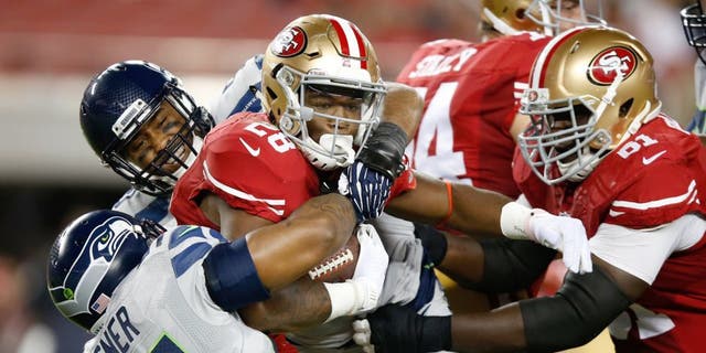 SANTA CLARA, CA - OCTOBER 22: Carlos Hyde #28 of the San Francisco 49ers rushes with the ball against the Seattle Seahawks during their NFL game at Levi's Stadium on October 22, 2015 in Santa Clara, California. (Photo by Ezra Shaw/Getty Images)